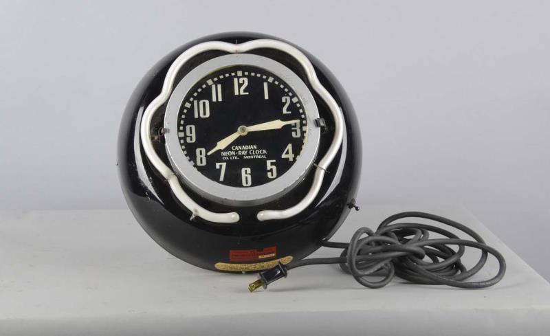 Appraisal: Porcelain Canadian Neon-Ray Wall Clock This heavy duty electric porcelain