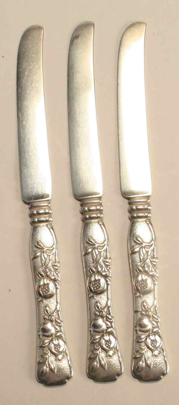 Appraisal: THREE TIFFANY STERLING SILVER TEA KNIVESIn the Vine - Pomegranate''