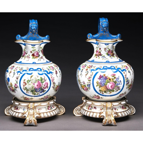 Appraisal: A pair of French porcelain ewers in the form of