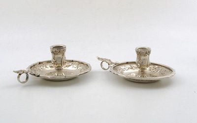 Appraisal: A pair of silver chamber sticks of shaped circular form