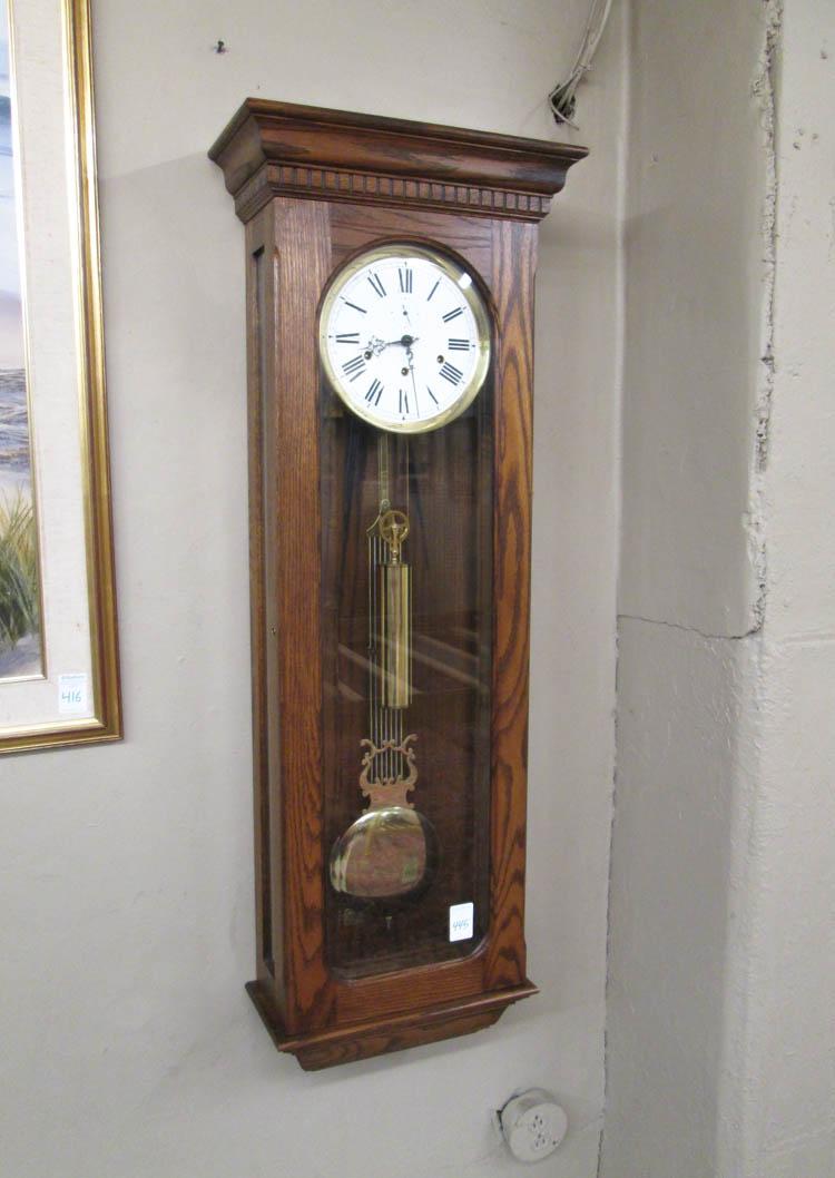 Appraisal: AN OAK LONGCASE WALL CLOCK a model Oxford Regulator clock