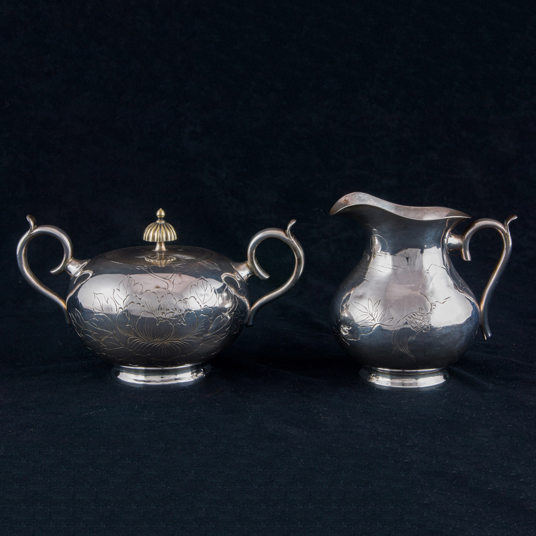 Appraisal: A JAPANESE SILVER CREAMER AND SUGAR SET A Japanese silver