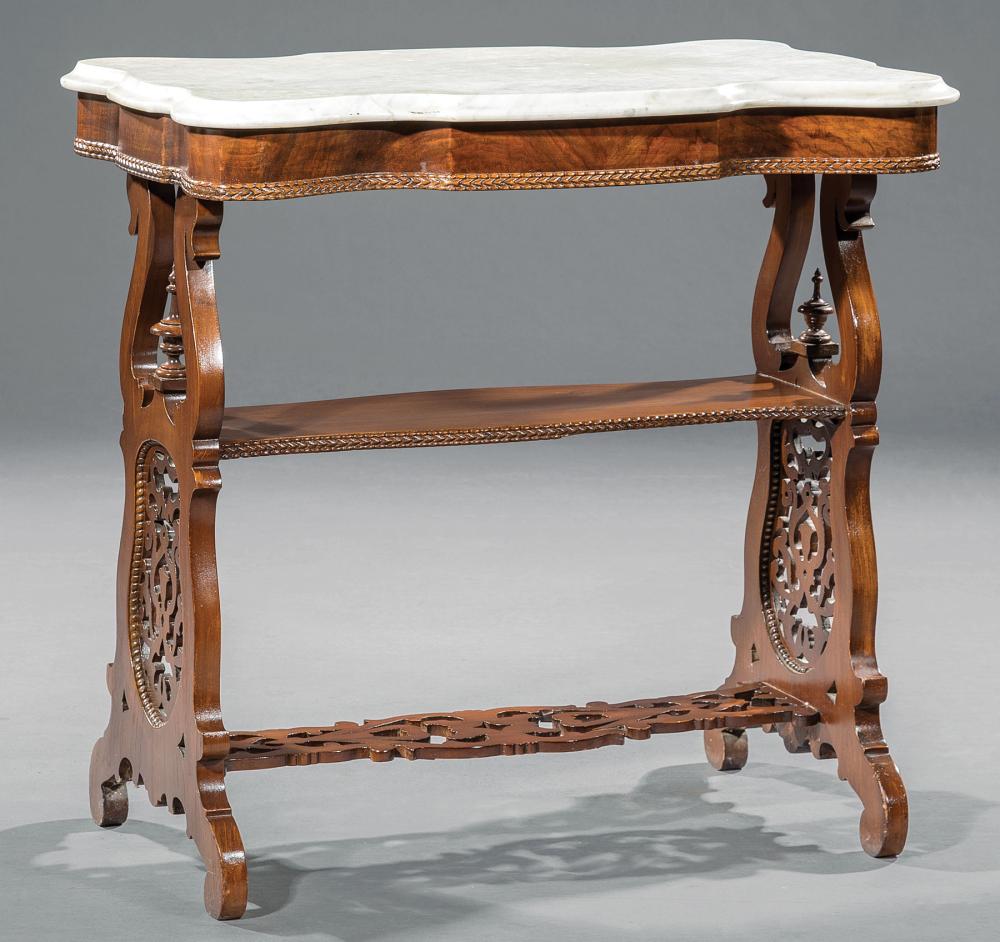 Appraisal: American Carved Mahogany Tiered Side Table mid- th c serpentine