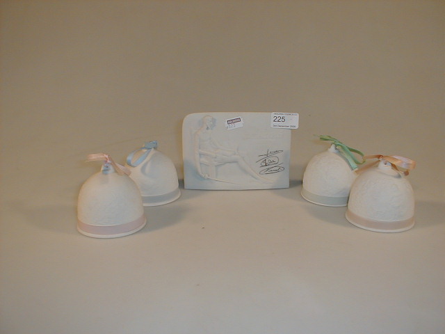 Appraisal: An advertising plaque for Lladro and Four Lladro decorative bells