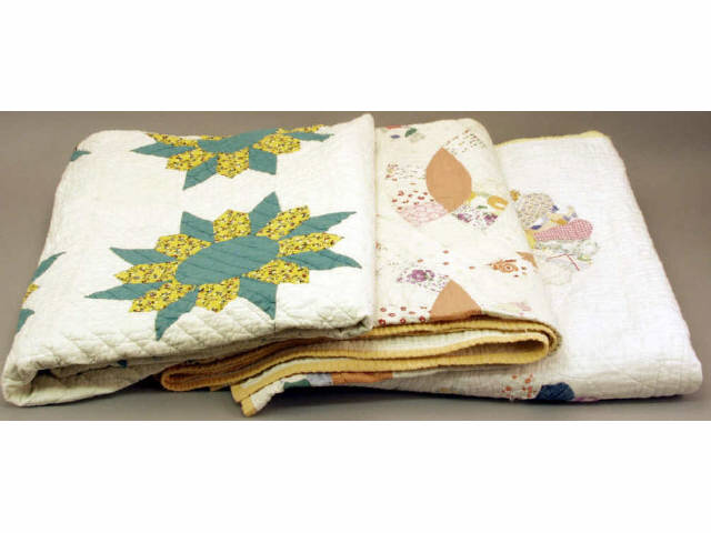 Appraisal: Collection of vintage quilts two showing stains and fray Estimate