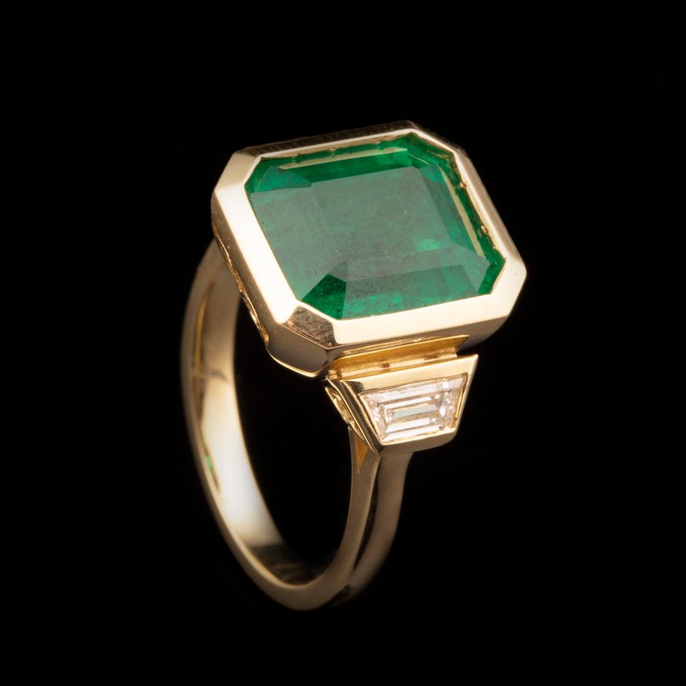 Appraisal: kt Yellow Gold Emerald and Diamond Ring center bezel-set octagonal