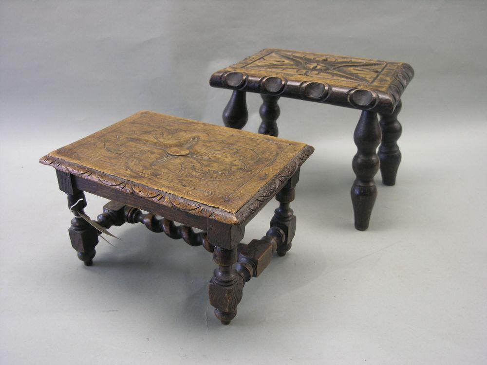 Appraisal: Two late Victorian dark oak footstools each with carved decoration