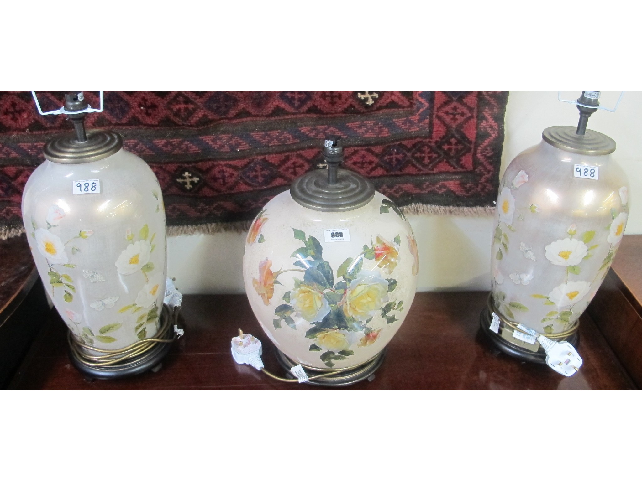 Appraisal: A pair of floral design table lamps and another