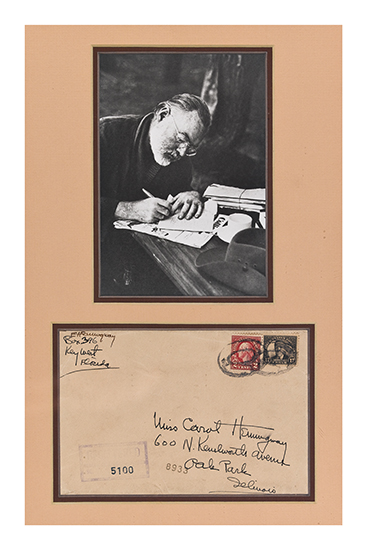 Appraisal: HEMINGWAY ERNEST Photograph of Hemingway writing at his desk framed