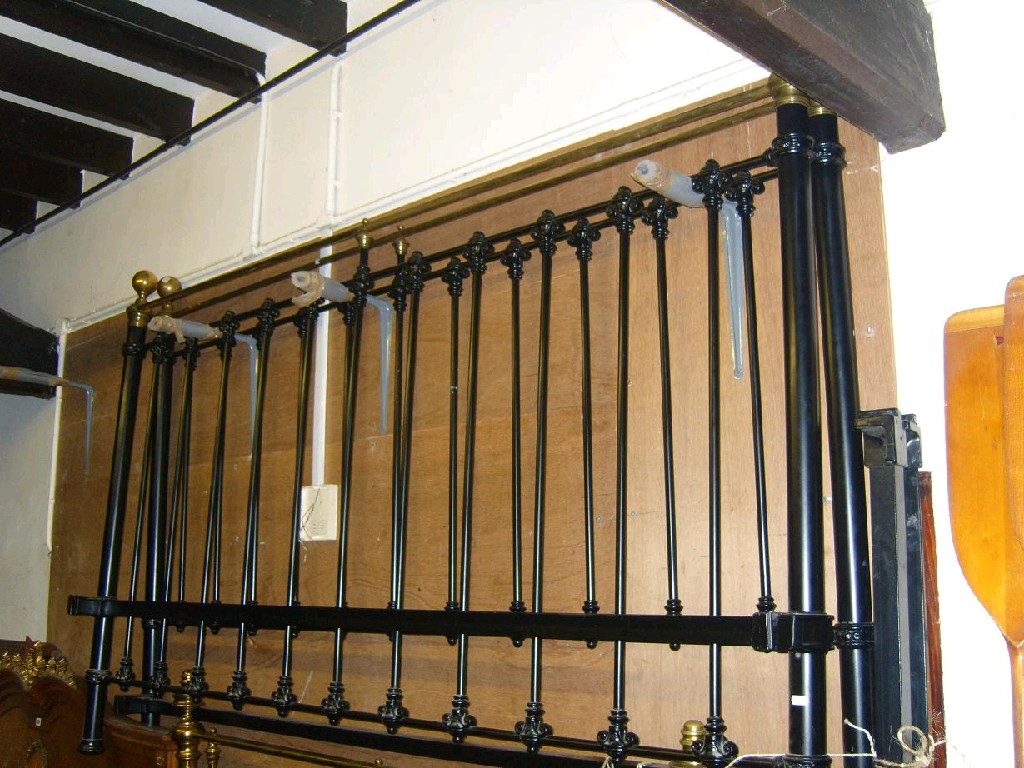 Appraisal: A Victorian style Emperor size bedstead with simple turned rails