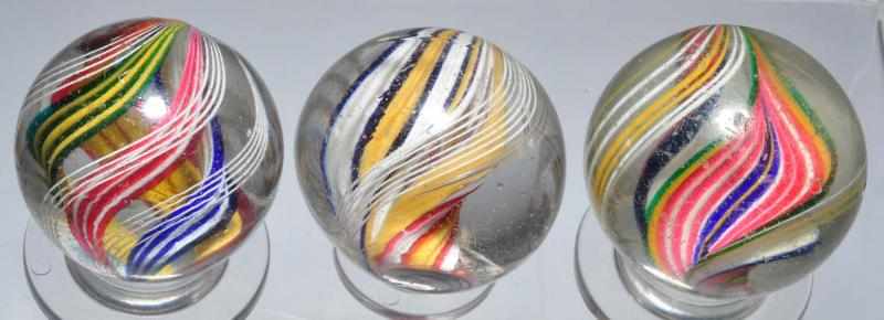 Appraisal: Lot of Multi-Colored Swirl Marbles Description Includes one double ribbon