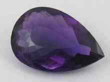 Appraisal: A loose polished pear shape amethyst of fine colour measuring