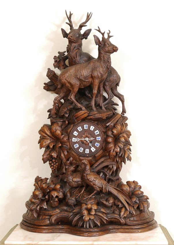 Appraisal: MONUMENTAL GAME ENHANCED BLACK FOREST CARVED MANTLE CLOCK Profusely carved