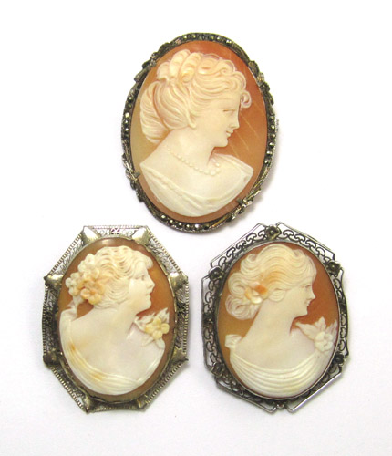 Appraisal: THREE VICTORIAN SHELL CARVED CAMEOS featuring Classical Revival adorned women