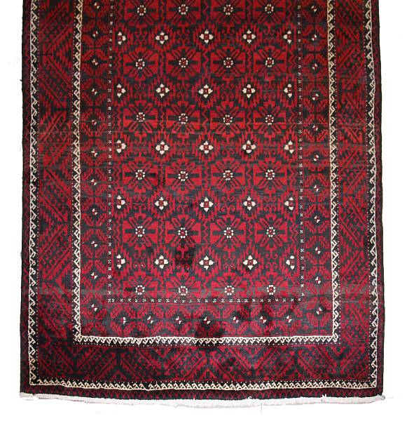 Appraisal: A Balouch carpet size approximately ft in x ft in