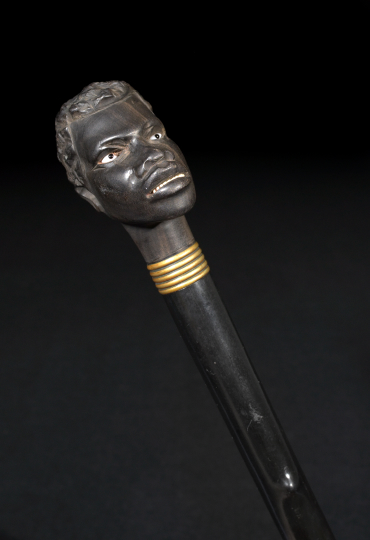 Appraisal: Anglo-Indian Carved and Ebonized Thorn and Macassar Ebony Blackamoor's Head