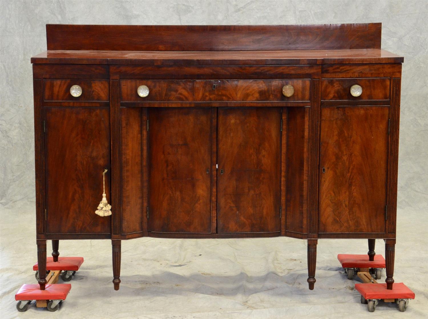 Appraisal: Mahogany Sheraton sideboard rectangular top with stepped out center over