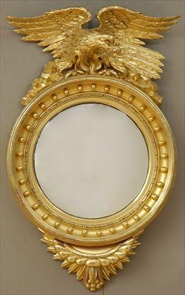 Appraisal: REGENCY CARVED GILTWOOD CONVEX MIRROR The ball-applied cavetto frame with