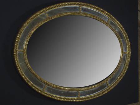 Appraisal: A George III style gilt wood mirror of oval form