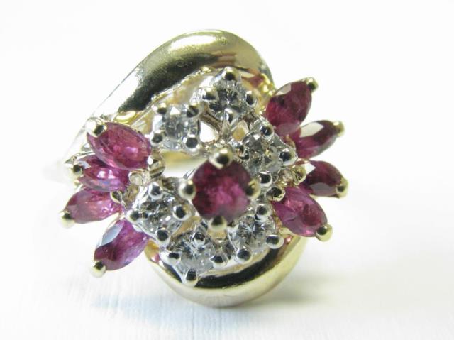 Appraisal: A K yellow gold diamond and ruby cluster ring with