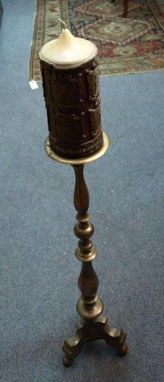 Appraisal: A brass pricket type candlestick of Carolean design raised on