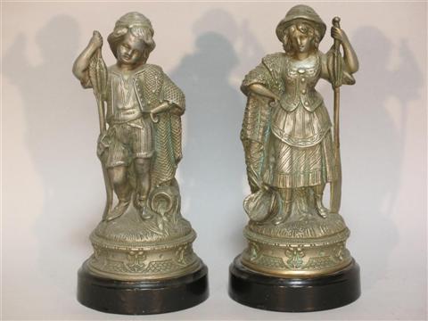 Appraisal: PAIR OF WHITE METAL FIGURES Modeled as a fisherman and