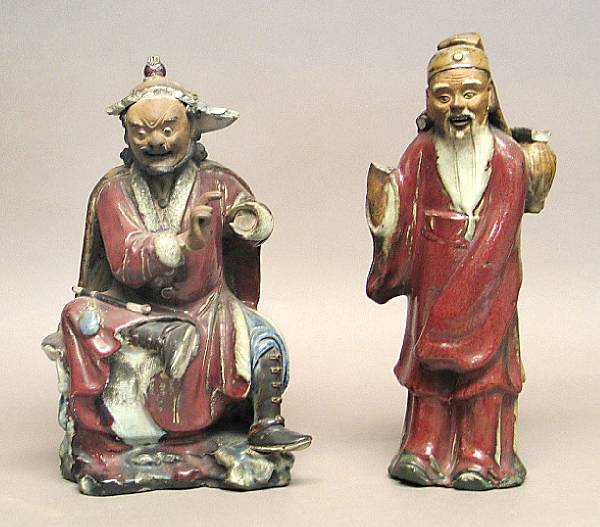 Appraisal: Two flamb glazed stoneware figures The first of a bearded