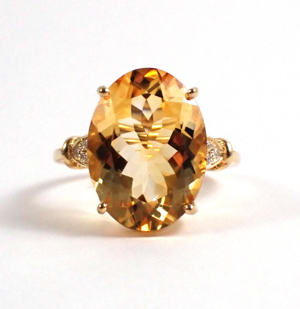 Appraisal: CITRINE DIAMOND AND FOURTEEN KARAT GOLD RING with three round-cut