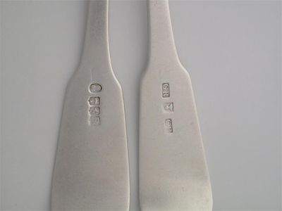 Appraisal: GEORGE RITCHIE A pair of fiddle and shell tablespoons and