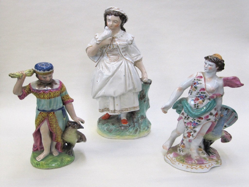 Appraisal: Staffordshire figure of a girl holding a dove and two