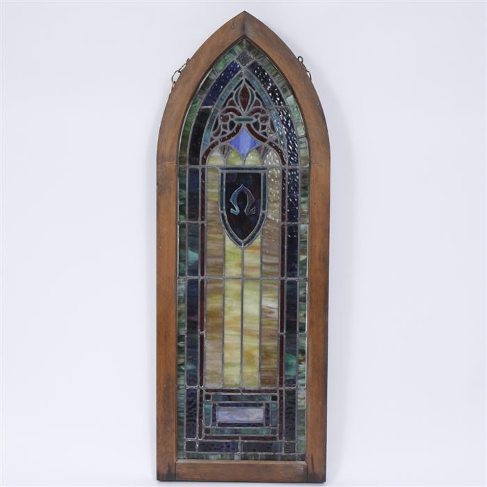 Appraisal: Gothic arch stained glass window with Omega in shield H