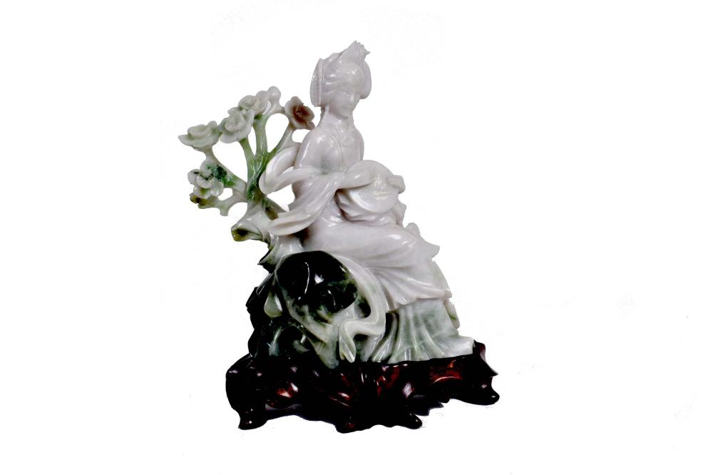 Appraisal: CHINESE WHITE GREEN JADE SEATED LADYThe elegant lady in elaborate