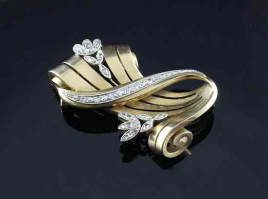 Appraisal: A stylish 's diamond set gold scroll brooch in gross