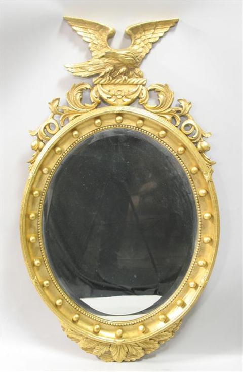 Appraisal: REGENCY STYLE GILTWOOD MIRROR th century the the oval mirror