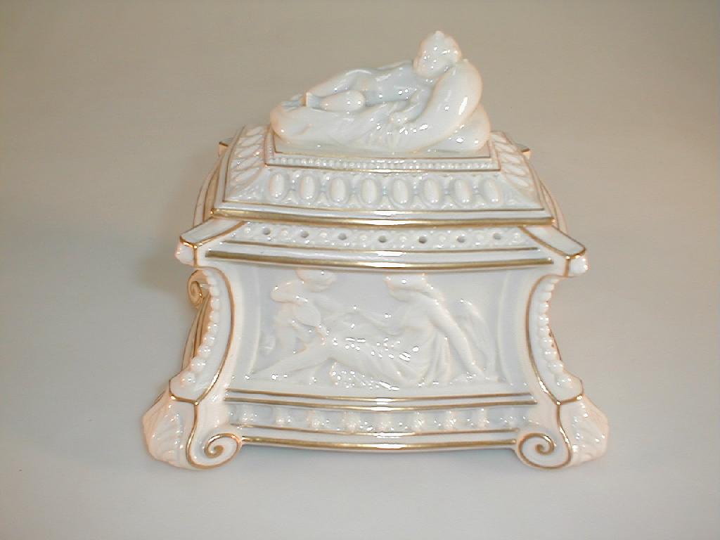 Appraisal: A Royal Worcester porcelain ivory-ground and gilt lined casket and