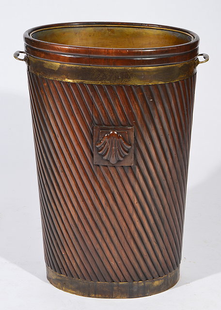 Appraisal: A GEORGIAN STYLE MAHOGANY OVAL TAPERING BRASS BOUND PEAT BUCKET