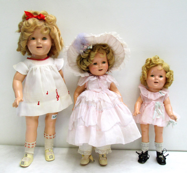 Appraisal: THREE COMPOSITION SHIRLEY TEMPLE DOLLS All have painted features sleep