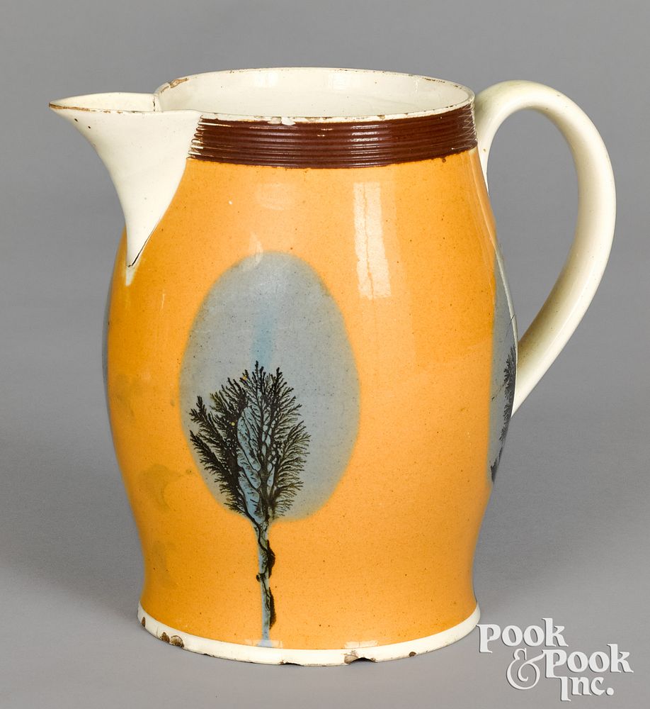 Appraisal: Mocha pitcher with seaweed over fan decoration Mocha pitcher with