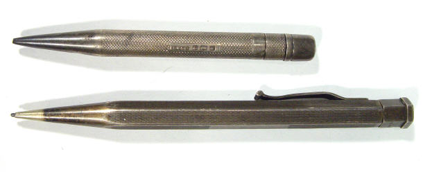 Appraisal: Two Edwardian silver propelling pencils with engine turned decoration to