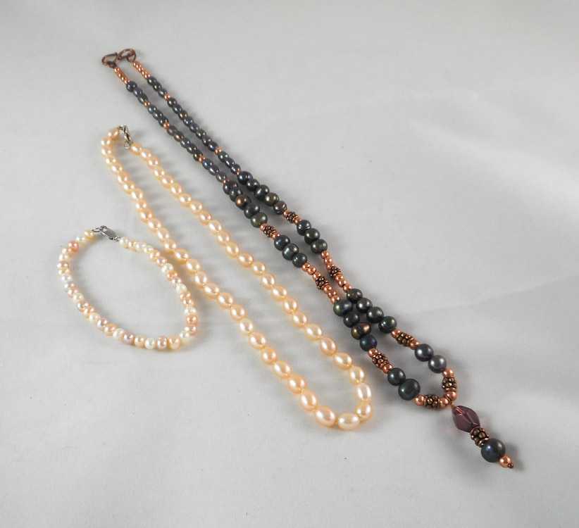 Appraisal: TWO PEARL NECKLACES AND ONE PEARL BRACELET the pink pearl