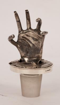 Appraisal: A silver decanter stopper LCC London modelled as a claw