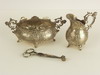 Appraisal: STERLING LOT - Three piece sterling floral repousse creamer and