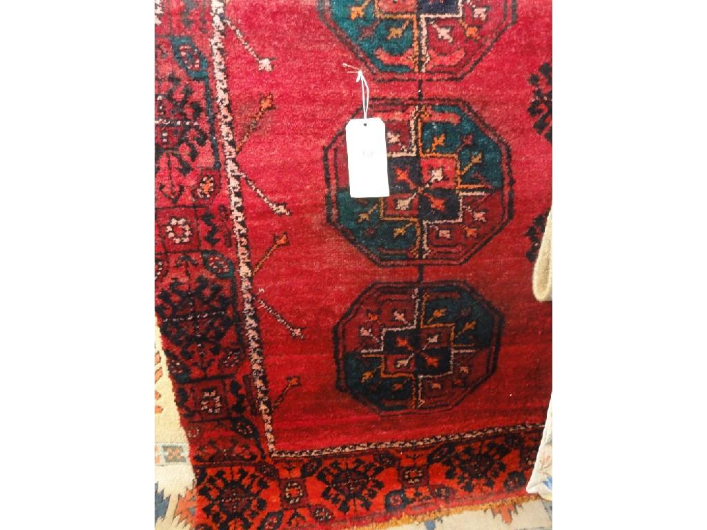 Appraisal: A Hamadan style carpet with two rows of six medallions