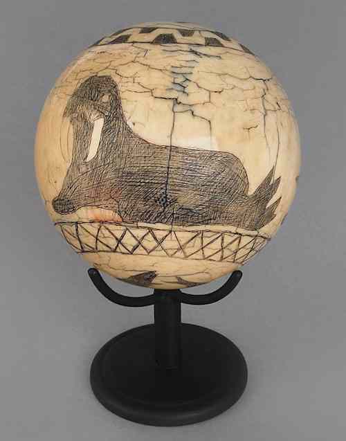 Appraisal: New England scrimshaw decorated ivory ball th c with center