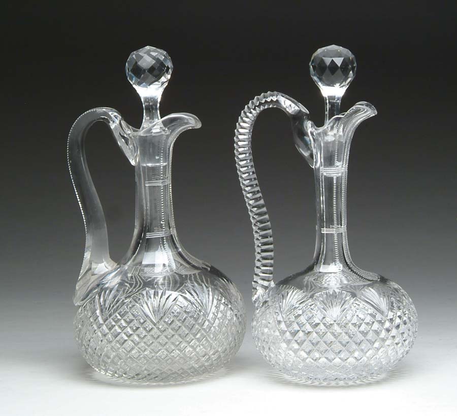 Appraisal: TWO CUT GLASS DECANTERS Two cut glass handled decanters are