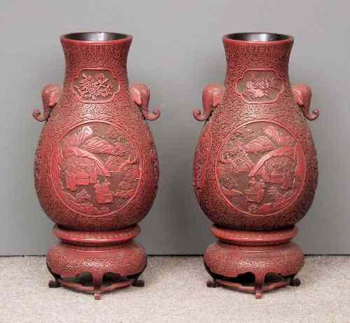 Appraisal: A pair of Chinese red cinnabar lacquer two-handled baluster shaped