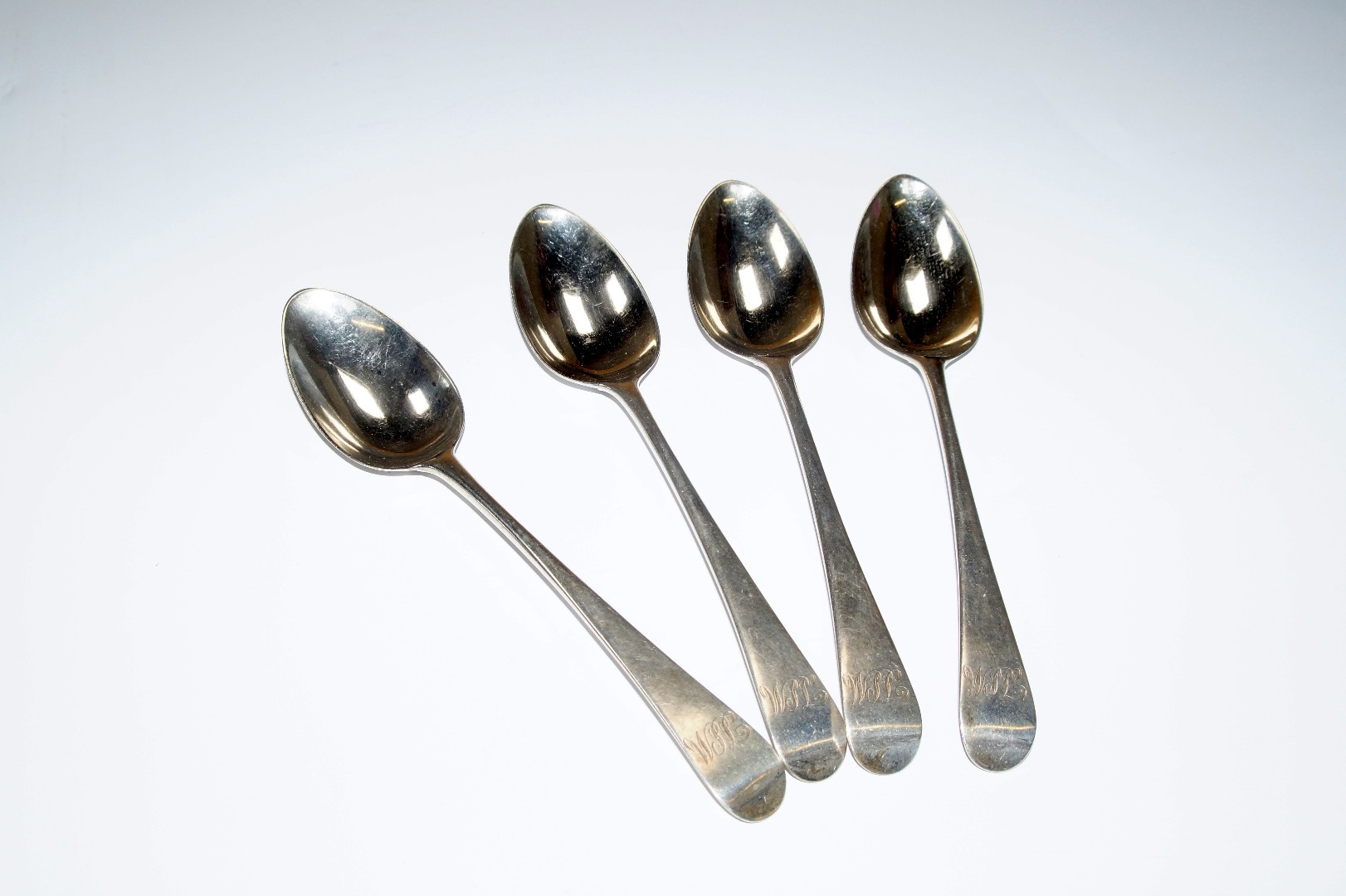 Appraisal: A set of four George III silver tablespoons decorated in