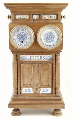 Appraisal: A late Victorian walnut and ceramic combination timepiece letterbox with