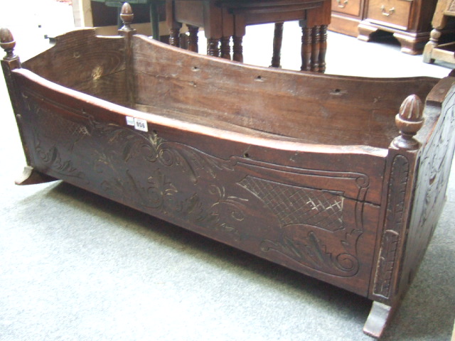 Appraisal: An th century style oak cradle log box with acorn