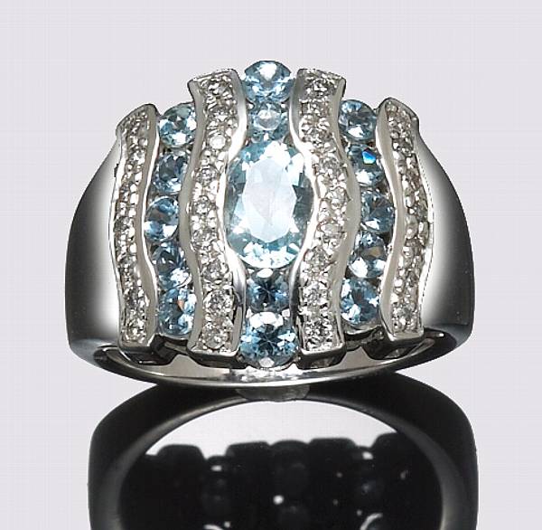 Appraisal: A blue topaz diamond and k white gold ring size